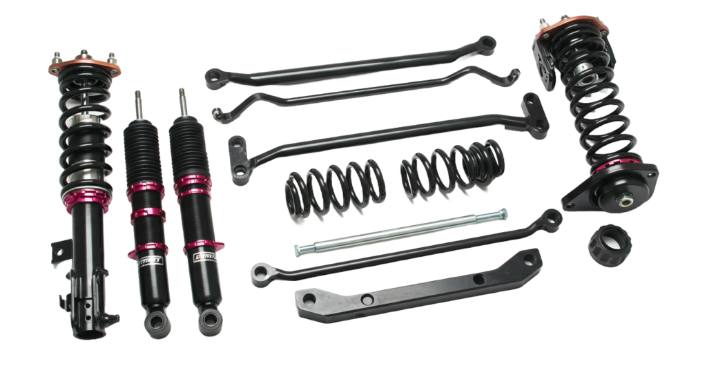 Complete automotive suspension kit: shocks, springs, control arms, and sway bars. Black and red components.